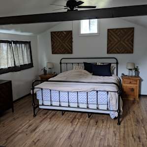 Bedroom with comfy king size bed (take after used, hence sheets are a little messed up)