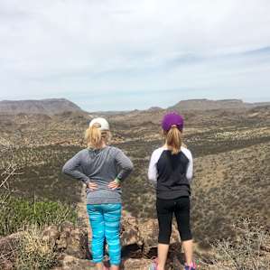 The kids surveying the overlook at Cinco Tinajas in BBRSP