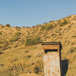 Jim is the outhouse-building King. You get your own private outhouse at this camp!