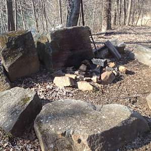 Site 1 fire pit -- large vertical rocks block the wind, large flat rocks provide seating. Perfectly designed!