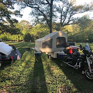 With us riding heavy street bikes and towing trailers, we chose to keep close to the level ground behind the main house. Very comfortable, shady, convenient area.