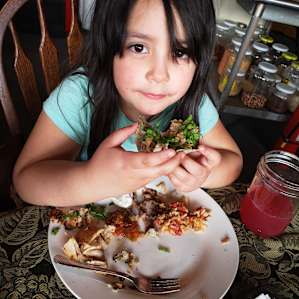 My daughter ( who's a picky eater) enjoying her tacos