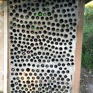 concrete + glass bottle wall of the bathroom