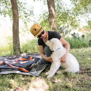 Tent setup is difficult when you have a cute face vying for your attention