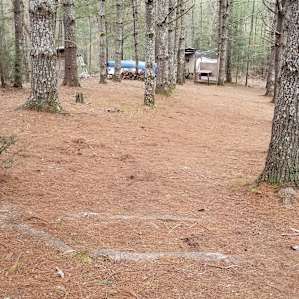 Shower, bathroom, and camper on site.