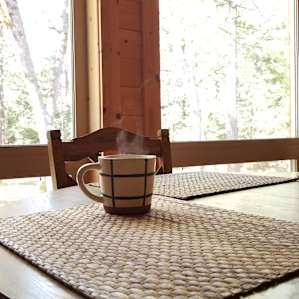 Sipping coffee while enjoying the outdoors.