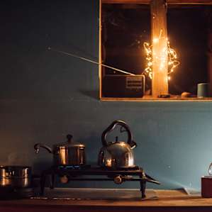 Kitchen set up complete with a gas stove and pots and pans for you to use.