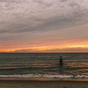 Breakwaters' sandy beach and salty water.