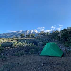 My friends tent setup looking toward the mountain range.