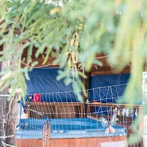 Beautiful area with a hottub surrounded by shade