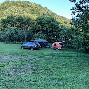 Camping in the corner by the creek.