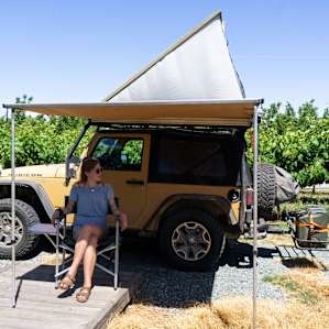 Campsite is surrounded by grape plants