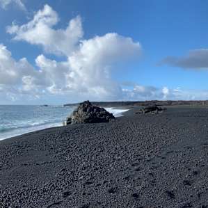 Pristine black sand beach, created by lava one year ago.