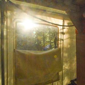 The sun can be seen setting from inside the tent as well.