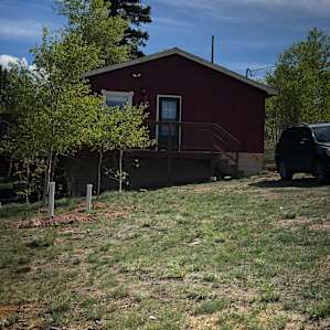 A Little Red Cottage in the Woods