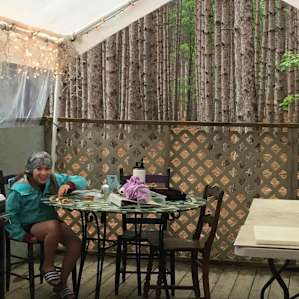 Eating area nestled in the woods.