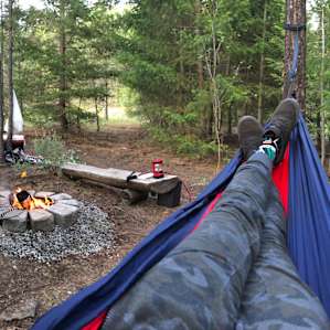 Tent site with campfire & hammocks