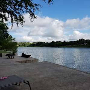 Cement dock at bottom by cabin for great relaxation on the water