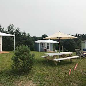 Wood cabins or tent sites.