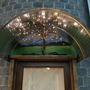 Evening's greetings; handmade light sculpture and a painting of the mountains just down the road.
