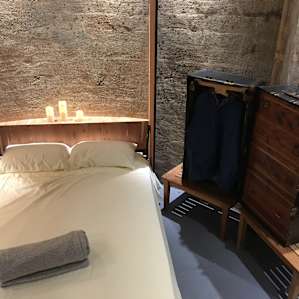 Beautiful, cozy bed on a custom-made Murphy frame.