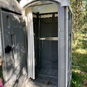 Solar shower. Not freezing water, but I never got anything other than cold water.