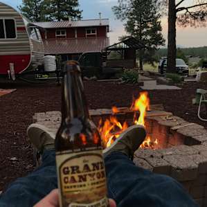 Enjoying a local beer around the Hunting Lodge fire