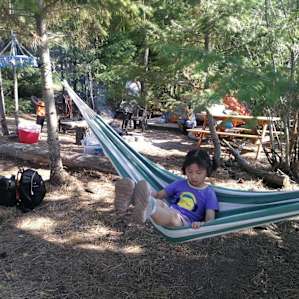 Tent site with campfire & hammocks