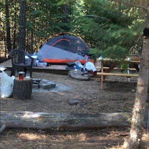 Tent site with campfire & hammocks