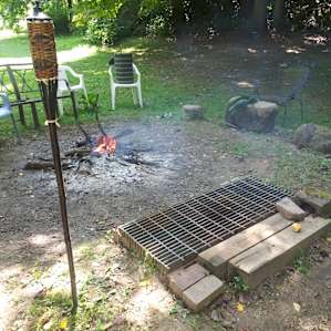The oversized grill grate would be perfect for anyone grilling for a large party of campers! Easy to shovel the coal right under the grate for a nice, hot meal experience around the fire. Jim's natural eucalyptus was the perfect deterrent- NOT ONE BITE on us!