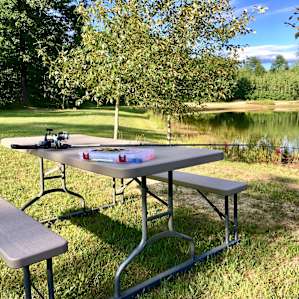 Picnic table, fishing poles provided