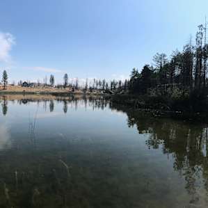 View from the middle of the lake facing the solar house.