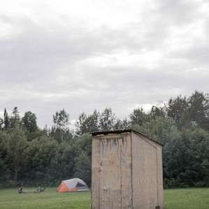 The outhouse is in perfect location to the barn and campsites