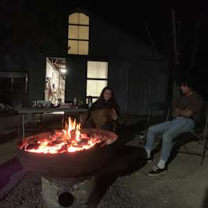 Trip the dog on my friend’s lap at the communal campfire fire
