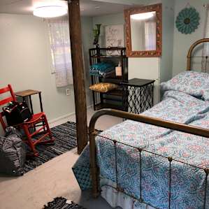 Bed and small sitting area
