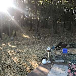 Small propane grill and water jug.