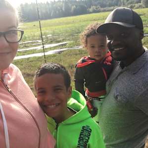 Our family with the cows in the back