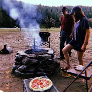 Scott helping my sister out with getting the pizza oven going!