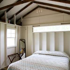 While the cabin isn't large, it is still able to fit a nice queen sized bed and some chairs.