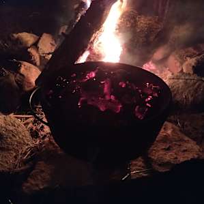 Rocks ring the fire pit and provide a great place to put hot cookery.