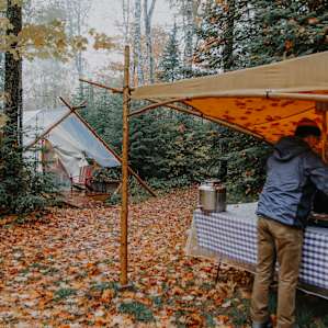 Preparing to cook under the covered table.