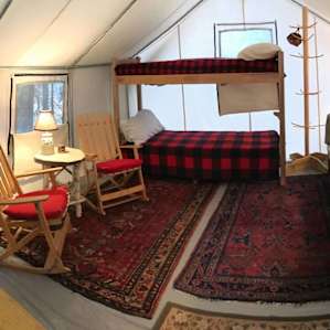 Panoramic view of the interior during the day. You'll have fun when you stay, finding all of the thoughtful little touches Chris and Linda have added, like the small basket hanging up by the top bunk so you can keep your glasses, phone, and headlamp handy.