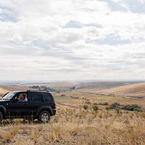 You'll need 4WD to get up this hill, but it's SO worth it! Also peep the main barn of the ranch down below.Great views of the Blue Mountains!!