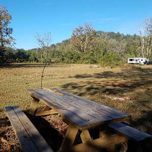 Picnic table close to the river looking up towards our camper