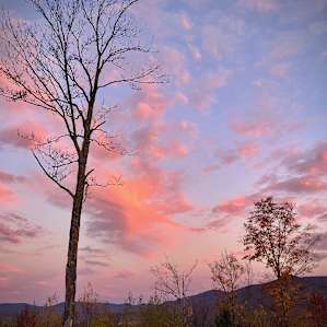 Sunrise, pink clouds all around.