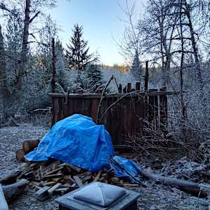Frosty outdoor fire pit and wood pile