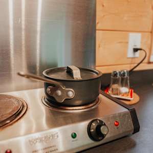 Super handy stovetop, some basic pots, and pans are provided.