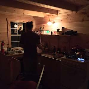 Washing dishes by gas lamp