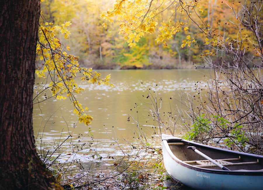 Canoe on a lake surrounded by autumn leaves at the Flying J Farm in Ohio