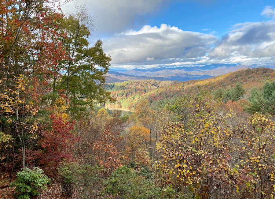 Blue Ridge mountain slopes covered in peak fall color near Mountaintop Fantasy Treehouse